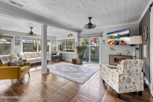 interior space with crown molding, a fireplace, and hardwood / wood-style floors