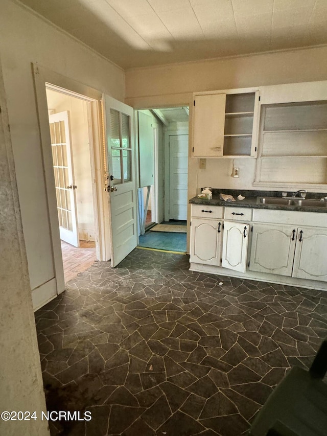 kitchen with sink and white cabinetry