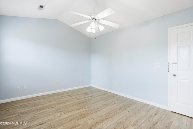 spare room with lofted ceiling, light hardwood / wood-style flooring, and ceiling fan