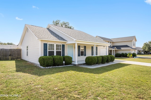 ranch-style home featuring a front yard and a garage