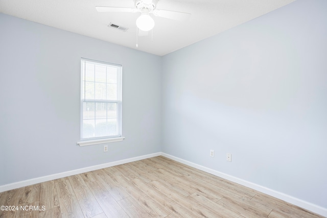 unfurnished room with ceiling fan and light hardwood / wood-style flooring