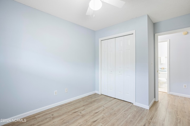 unfurnished bedroom with a closet, light wood-type flooring, and ceiling fan