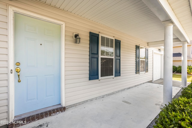 property entrance featuring covered porch