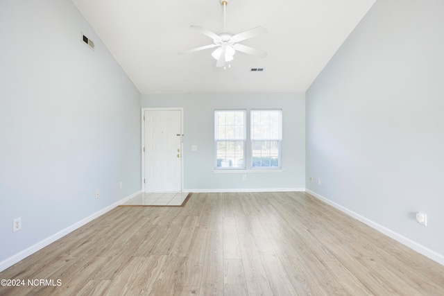 spare room with light hardwood / wood-style flooring and ceiling fan