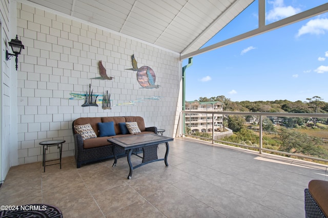 view of patio featuring a balcony