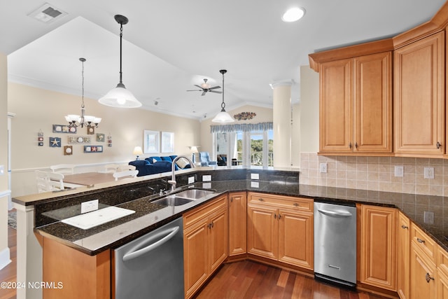 kitchen with dark wood-type flooring, sink, kitchen peninsula, pendant lighting, and dishwasher