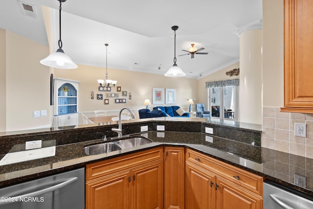 kitchen featuring stainless steel dishwasher, dark stone countertops, sink, decorative light fixtures, and backsplash