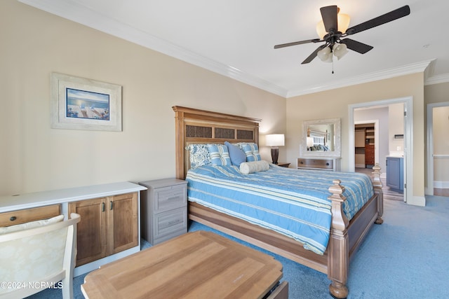 carpeted bedroom with crown molding and ceiling fan