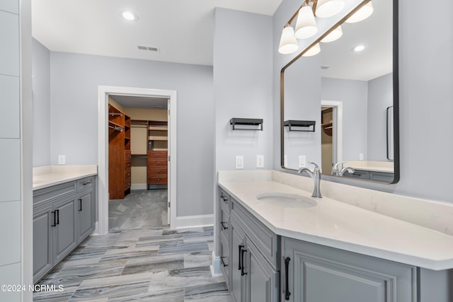 bathroom featuring vanity and hardwood / wood-style flooring