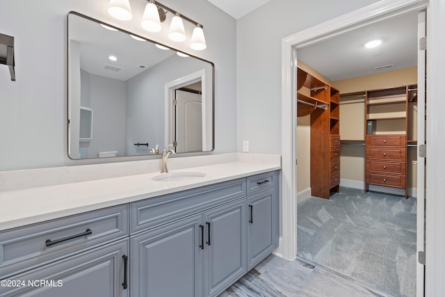 bathroom featuring toilet and vanity