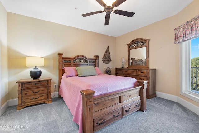 bedroom with ceiling fan and light colored carpet