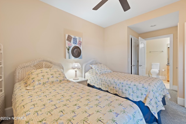 carpeted bedroom with ceiling fan and connected bathroom