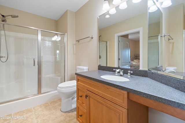 bathroom featuring walk in shower, tile patterned floors, vanity, and toilet