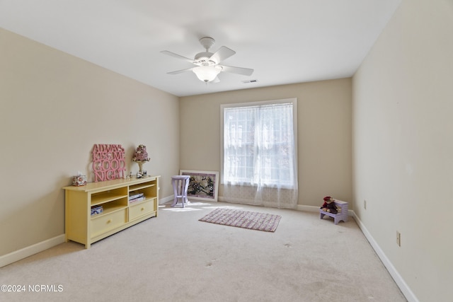 playroom featuring carpet and ceiling fan