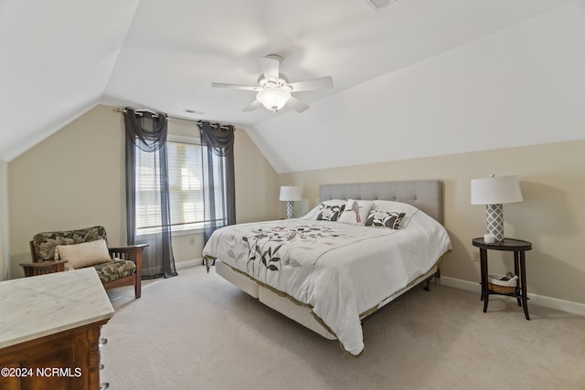 bedroom featuring lofted ceiling, light carpet, and ceiling fan