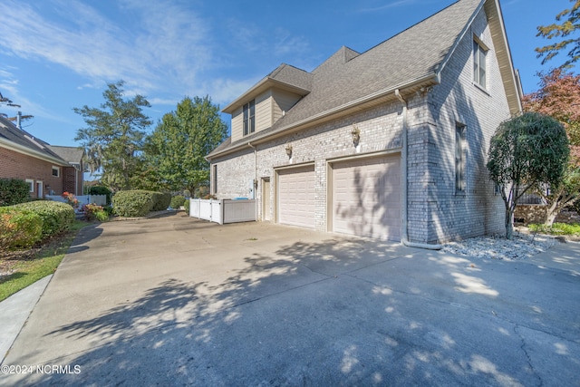 view of property exterior with a garage