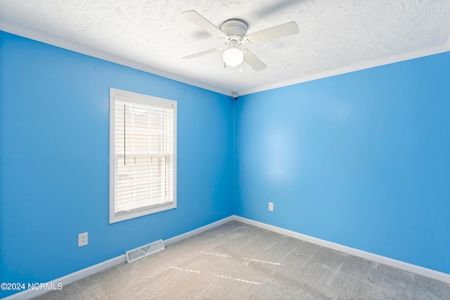 unfurnished room featuring ceiling fan, ornamental molding, and light colored carpet