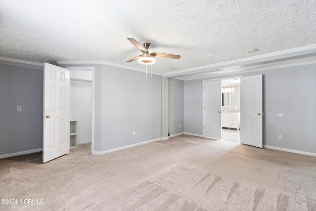 interior space with light carpet, a textured ceiling, and ceiling fan