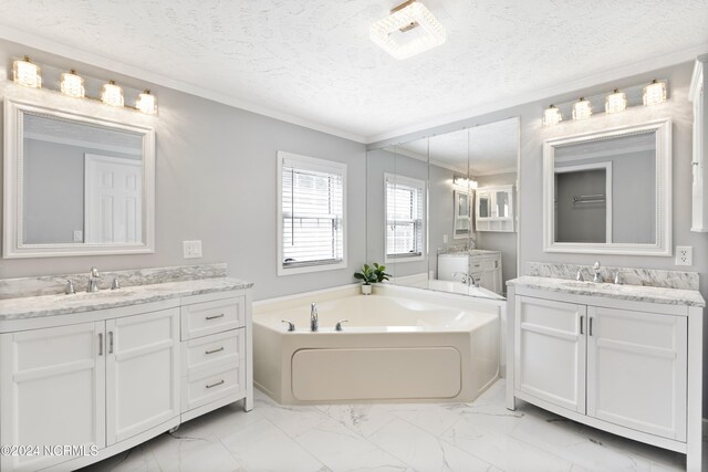 bathroom with a sink, two vanities, a bath, ornamental molding, and marble finish floor