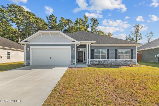 craftsman-style home with a garage and a front lawn