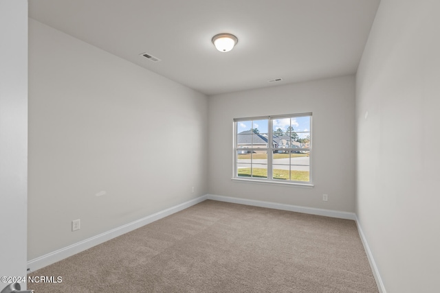 unfurnished room with carpet flooring