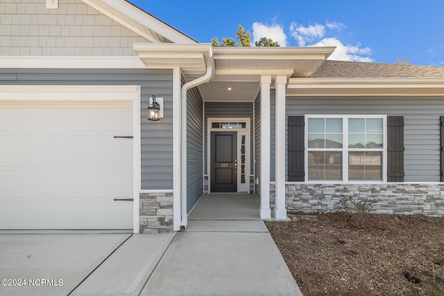 entrance to property featuring a garage