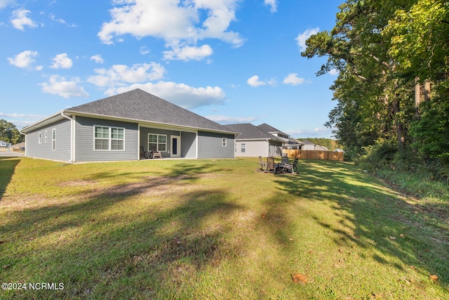 back of house with a yard