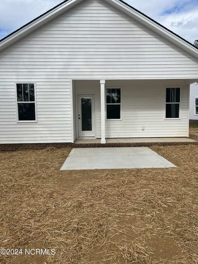 rear view of property featuring a patio