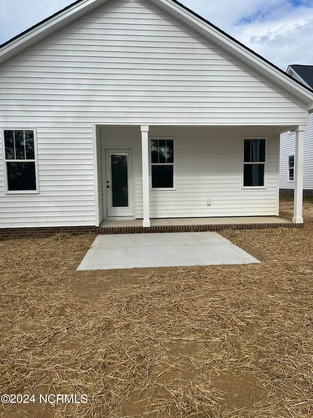 back of property featuring a patio area