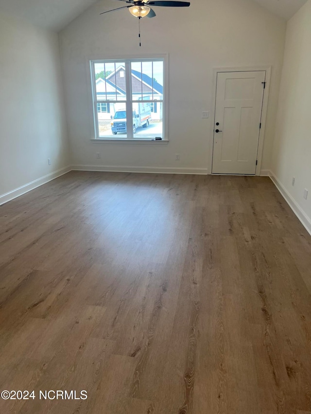 interior space with ceiling fan, hardwood / wood-style floors, and vaulted ceiling