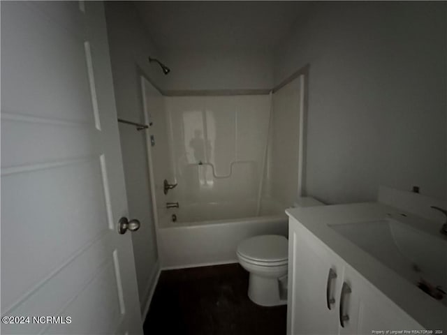 full bathroom with  shower combination, vanity, and toilet