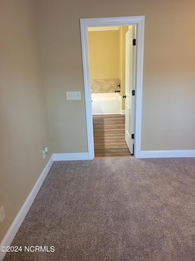 unfurnished room with carpet flooring