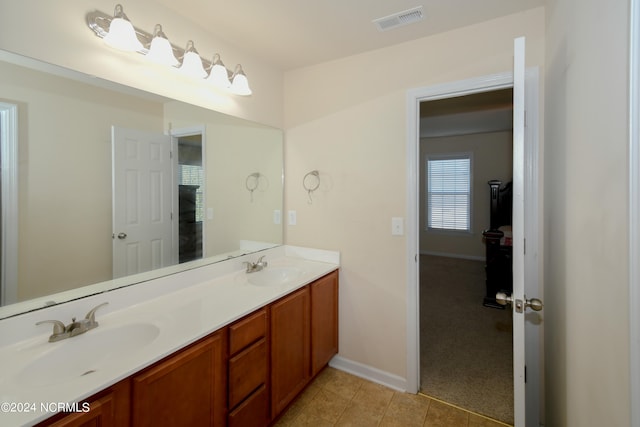 bathroom with vanity and tile patterned flooring