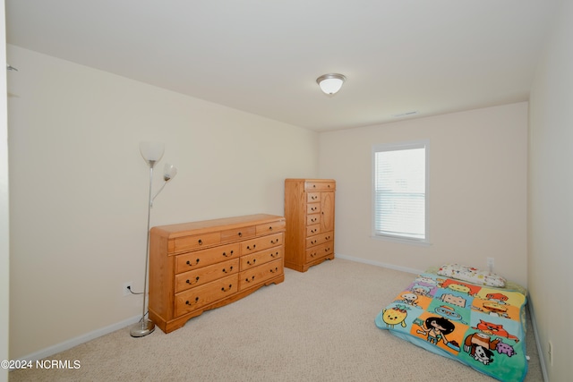 recreation room featuring light carpet