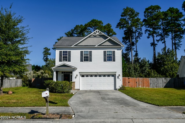 view of front of home with a front yard and a garage