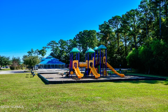 view of playground with a yard