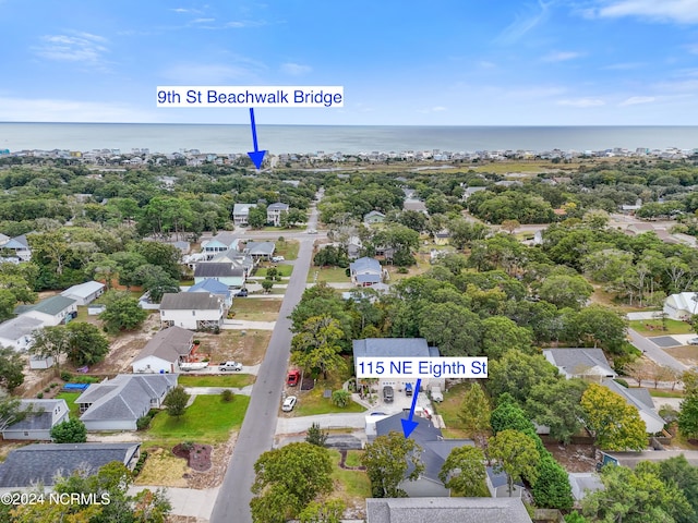 drone / aerial view with a residential view and a water view