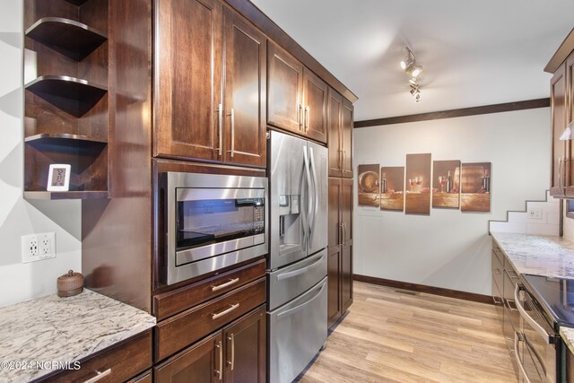 living room with crown molding, light hardwood / wood-style flooring, and rail lighting