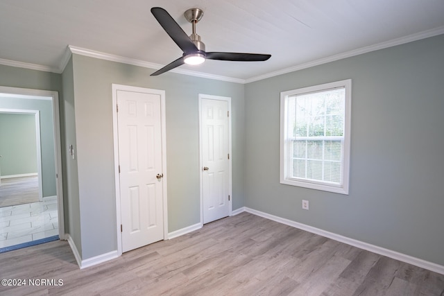 unfurnished bedroom with light hardwood / wood-style floors, crown molding, and ceiling fan