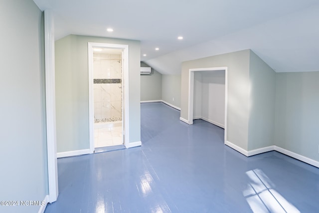 additional living space featuring a wall unit AC