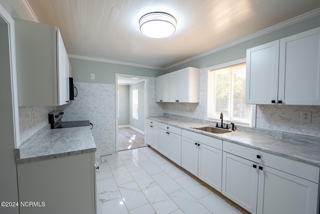 kitchen featuring stainless steel electric stove, crown molding, sink, and white cabinets