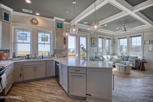 kitchen with a healthy amount of sunlight, sink, and gray cabinetry