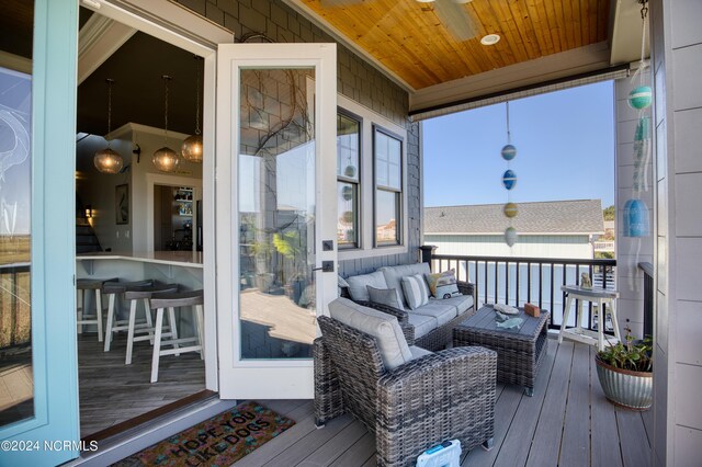 wooden deck with ceiling fan