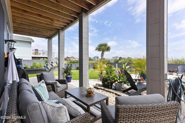 deck featuring ceiling fan and an outdoor living space