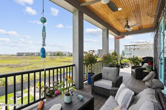 balcony featuring ceiling fan