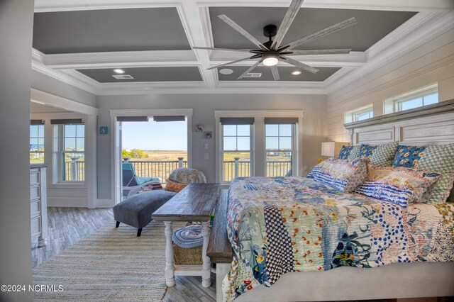 bedroom featuring ornamental molding, ceiling fan, access to exterior, coffered ceiling, and light wood-type flooring