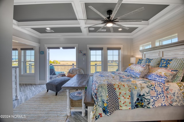 bedroom with multiple windows, coffered ceiling, and access to outside