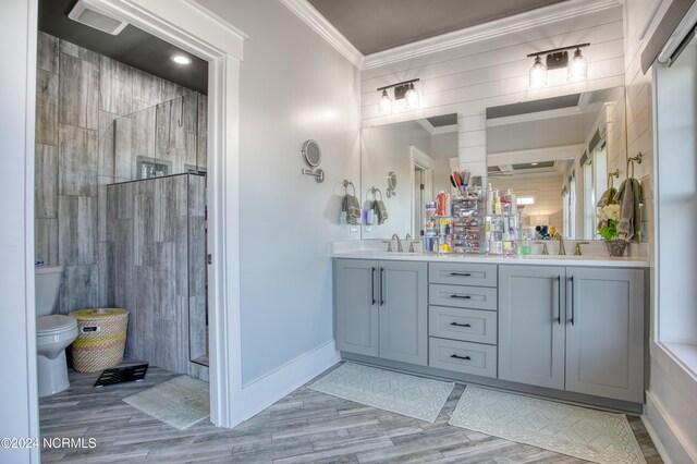 bathroom with tile patterned floors, toilet, tiled shower, and tile walls