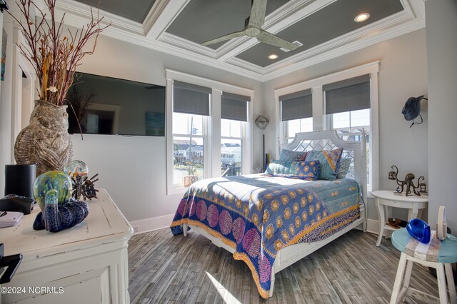 bedroom with wood-type flooring, ceiling fan, crown molding, and a closet