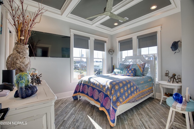 bedroom with coffered ceiling, hardwood / wood-style flooring, and ornamental molding